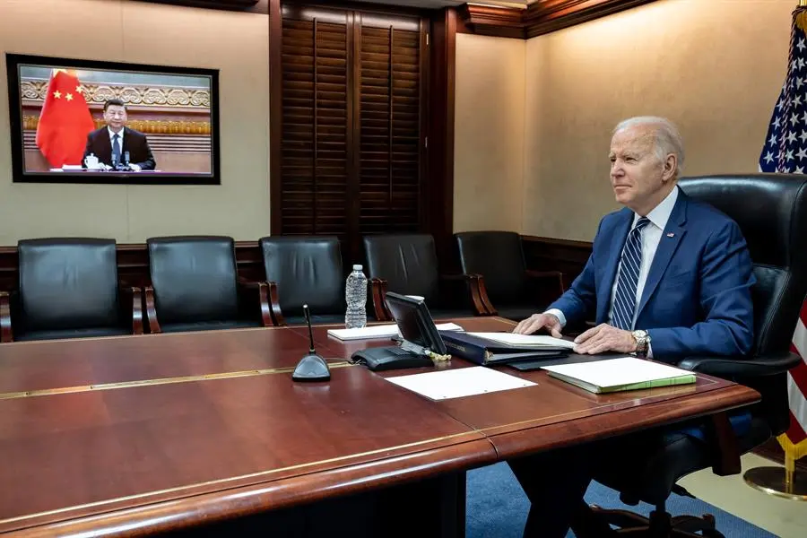 Biden warns Xi of